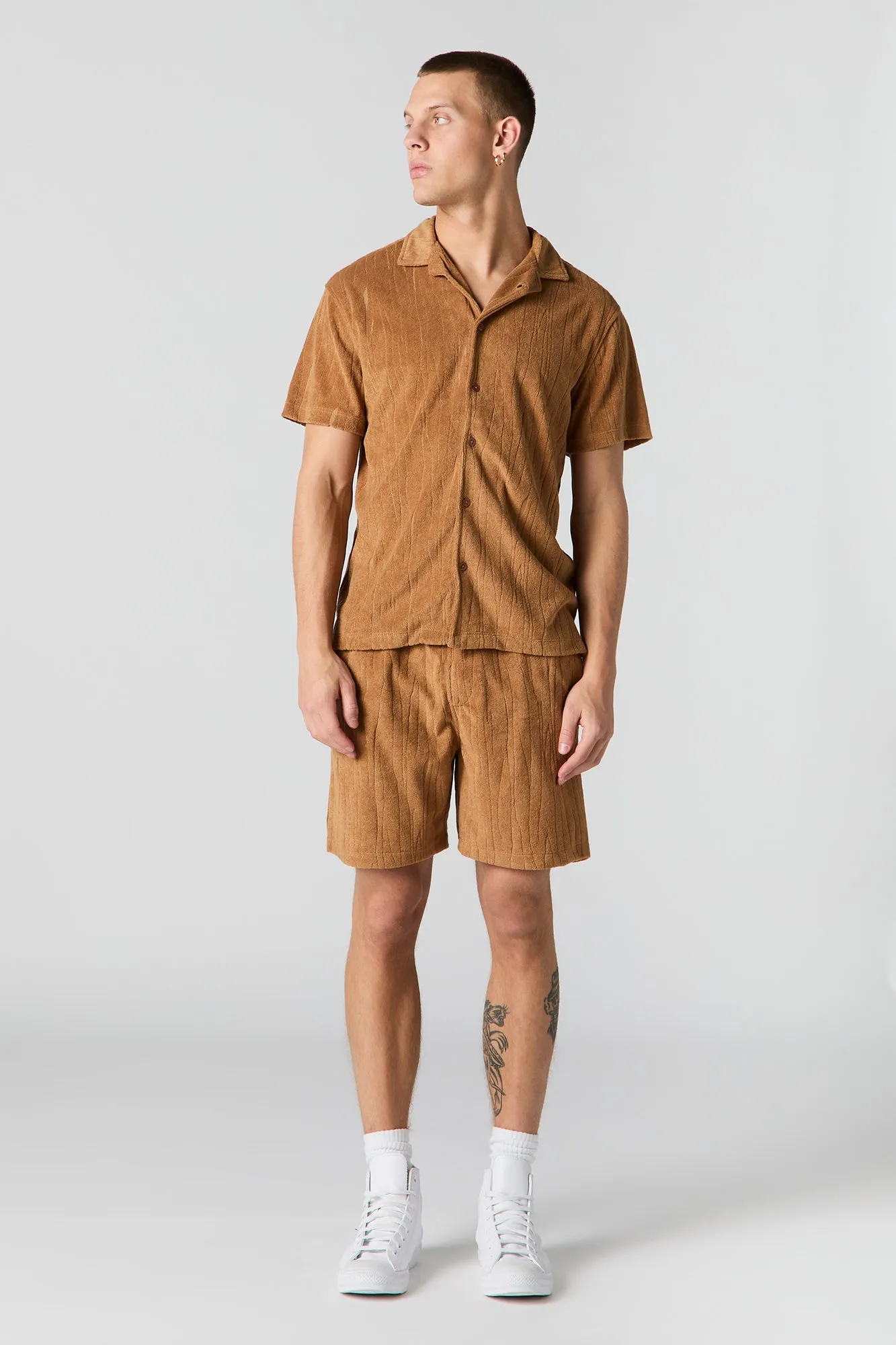Haut boutonné en tissu éponge texturé