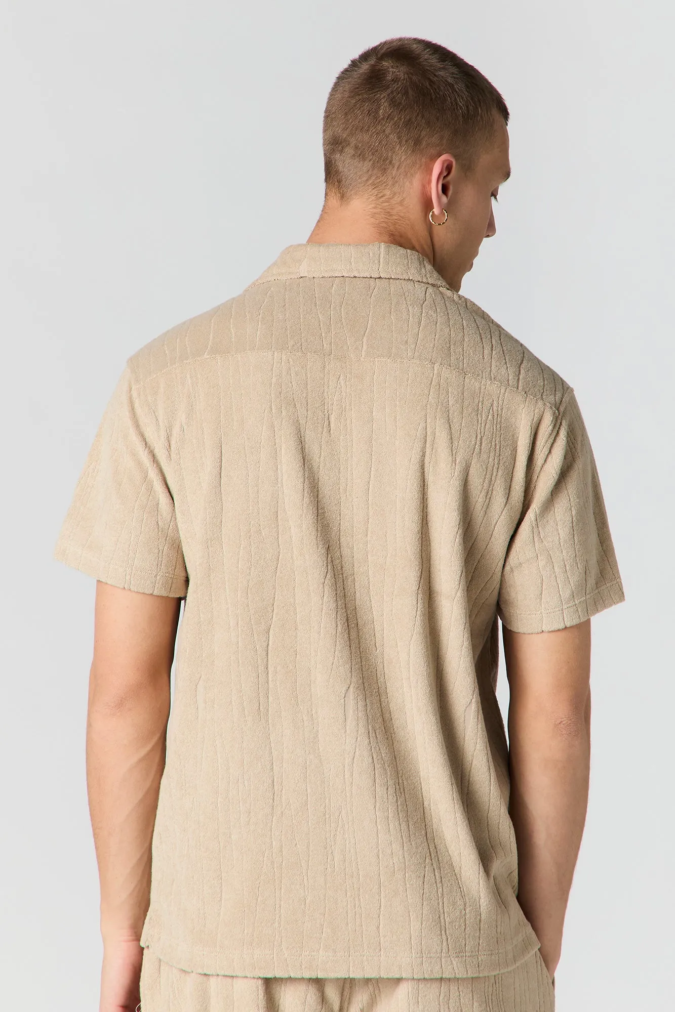 Haut boutonné en tissu éponge texturé