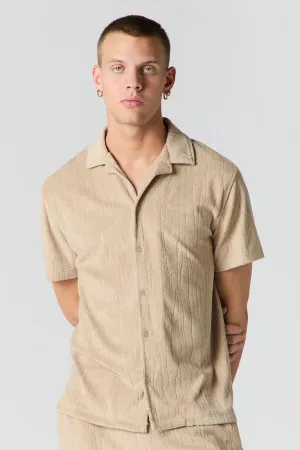Haut boutonné en tissu éponge texturé