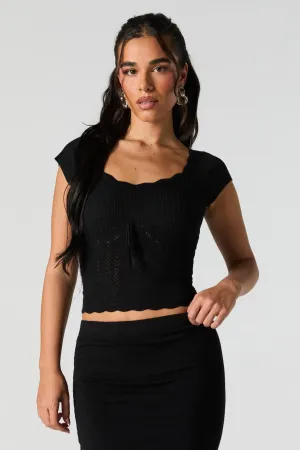 Haut à manches courtes en tricot de pointelle et  encolure arrondie