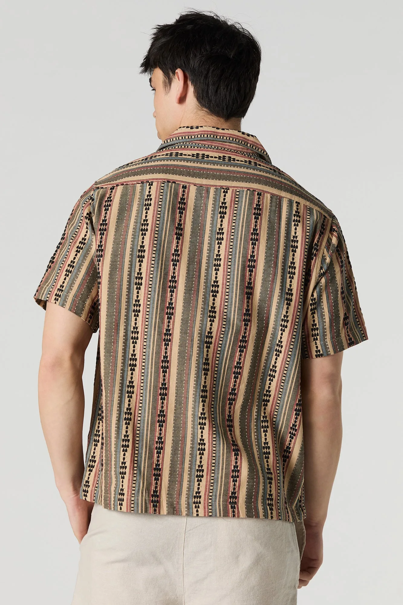 Haut rayé boutonné à manche courte